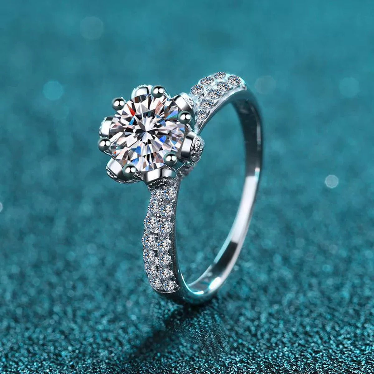Round Moissanite Side Stone Ring with CZ in Rhodium-Plated S925 Sterling Silver blue display product photo showing the moissanite setting and band profile