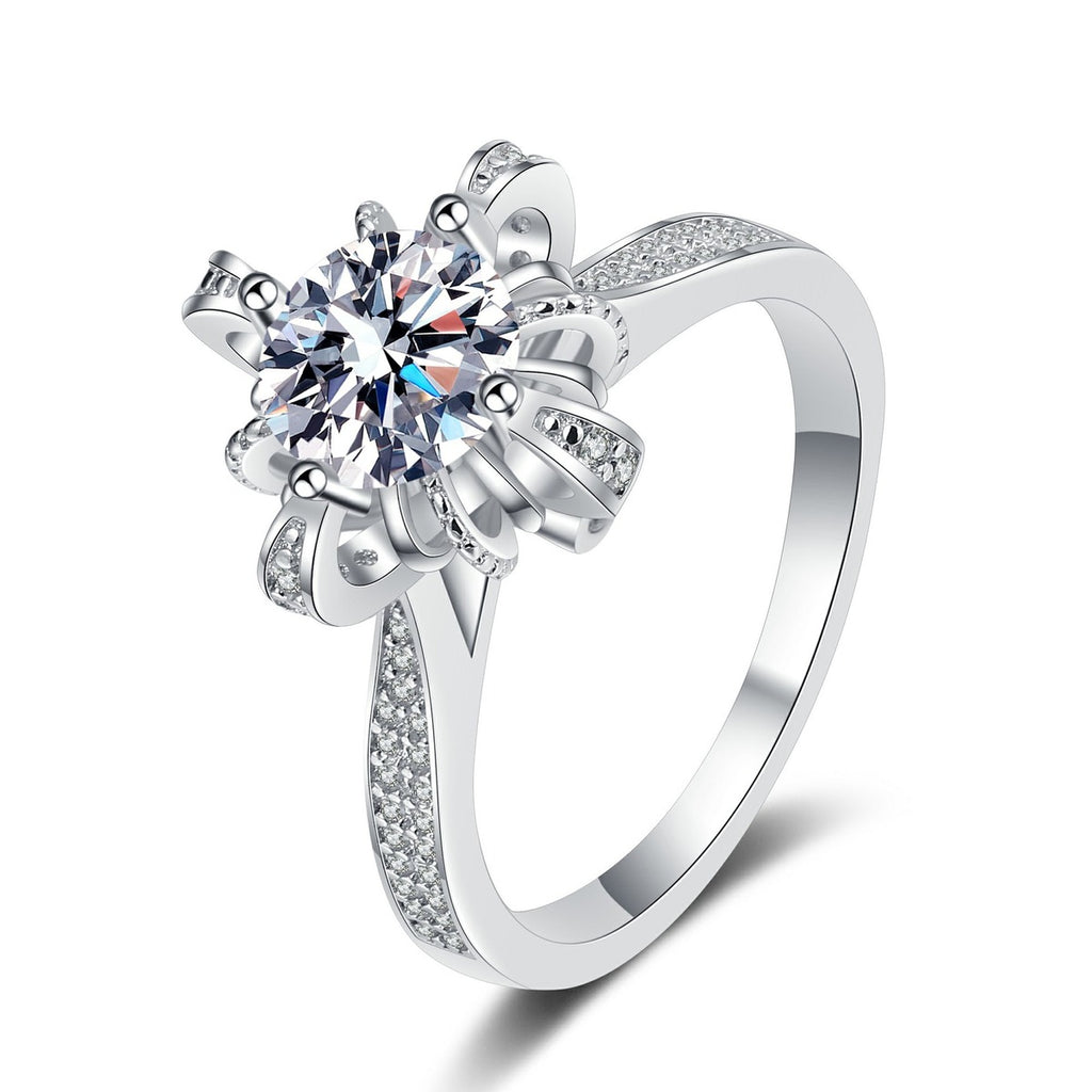 Round Floral Halo Moissanite Ring with CZ in rhodium-plated S925 sterling silver on clean white background