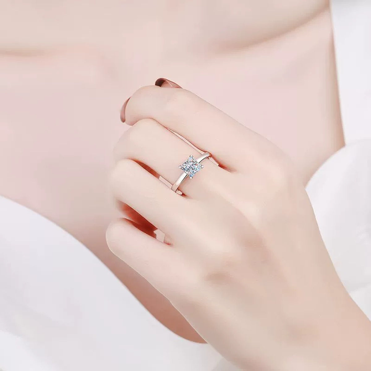 Princess Cut Moissanite Ring in Rhodium-Plated S925 Sterling Silver worn on hand, showing scale, finger coverage, and rhodium-plated finish