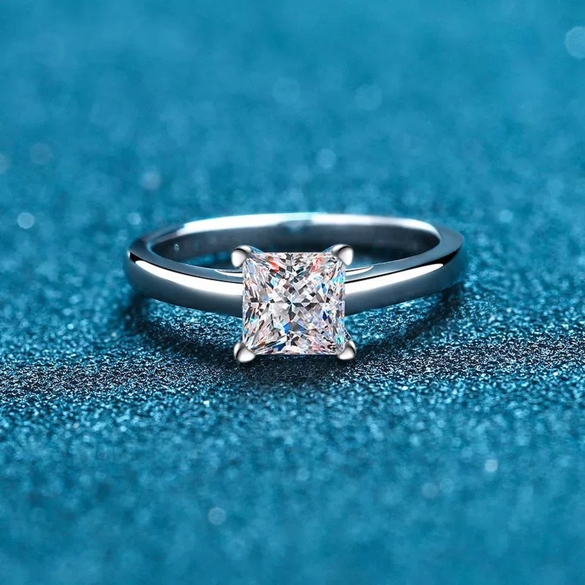 Princess Cut Moissanite Ring in Rhodium-Plated S925 Sterling Silver blue display product photo showing the moissanite setting and band profile