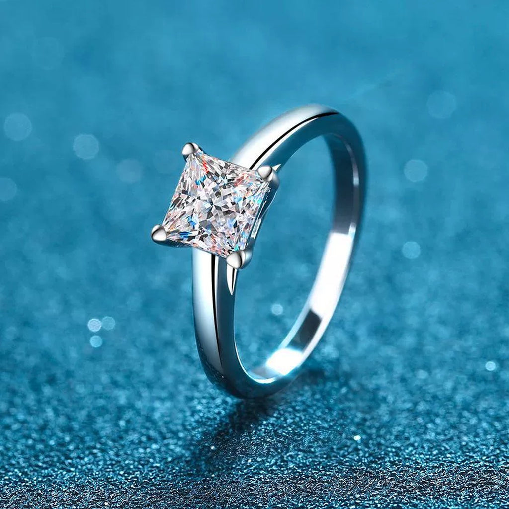Princess Cut Moissanite Ring in Rhodium-Plated S925 Sterling Silver blue display product photo showing the moissanite setting and band profile