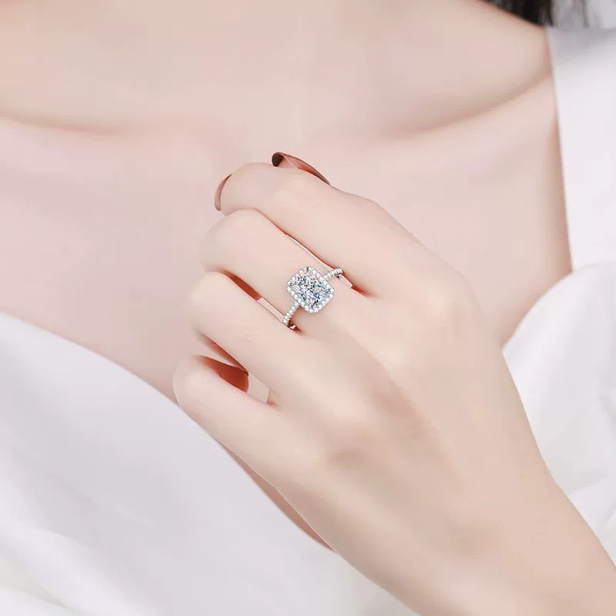 Radiant and Emerald Cut Moissanite Ring with CZ in Rhodium-Plated S925 Sterling Silver worn on hand, showing scale, finger coverage, and rhodium-plated finish