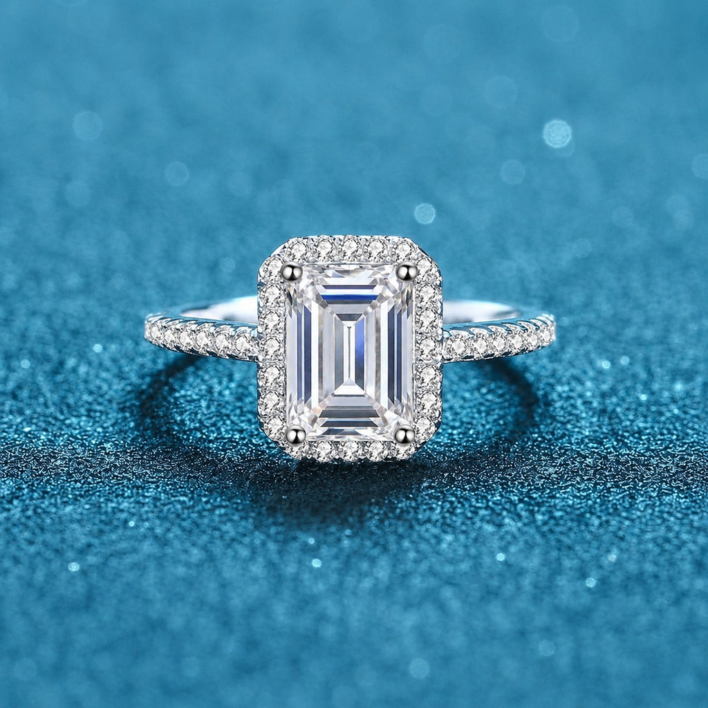 Radiant and Emerald Cut Moissanite Ring with CZ in Rhodium-Plated S925 Sterling Silver blue display product photo showing the moissanite setting and band profile