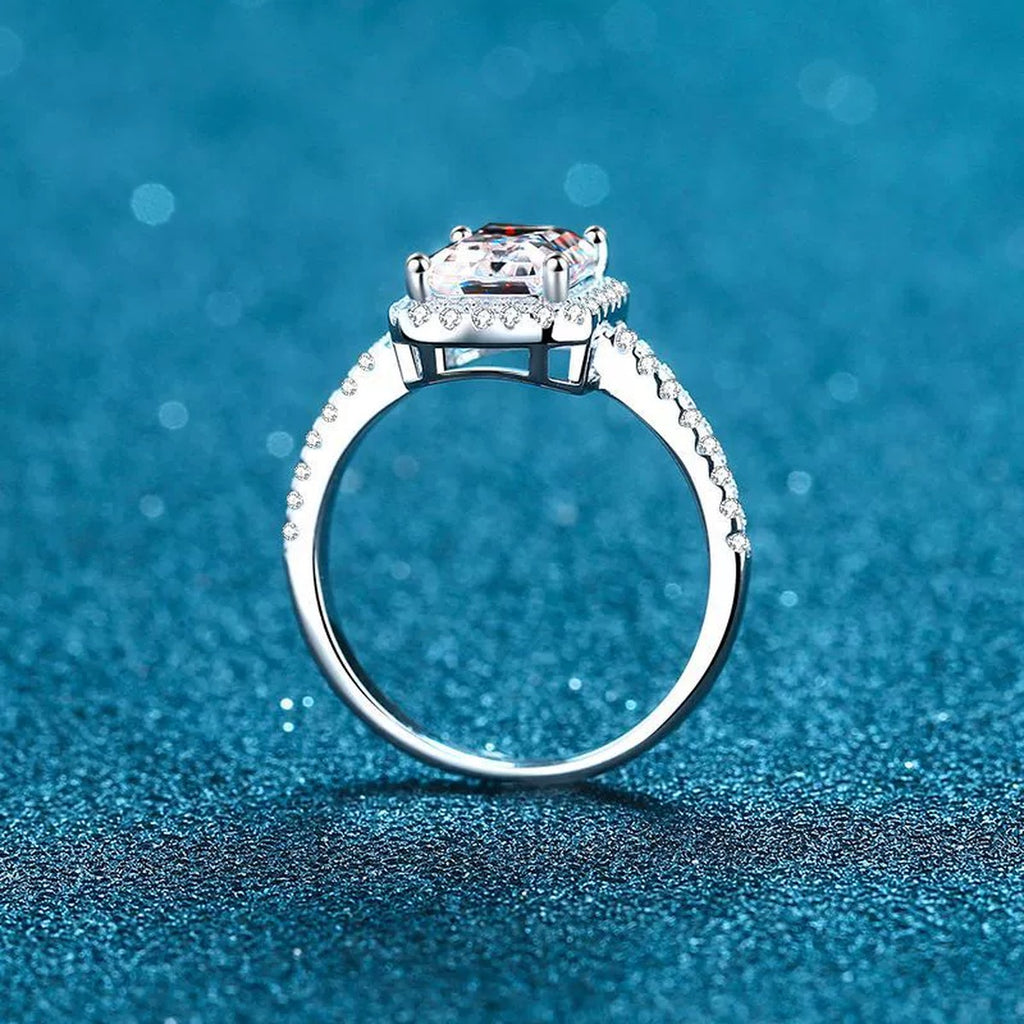 Radiant and Emerald Cut Moissanite Ring with CZ in Rhodium-Plated S925 Sterling Silver blue display product photo showing the moissanite setting and band profile