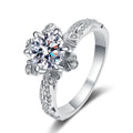 Round Floral Moissanite Engagement Ring with CZ in rhodium-plated S925 sterling silver on clean white background