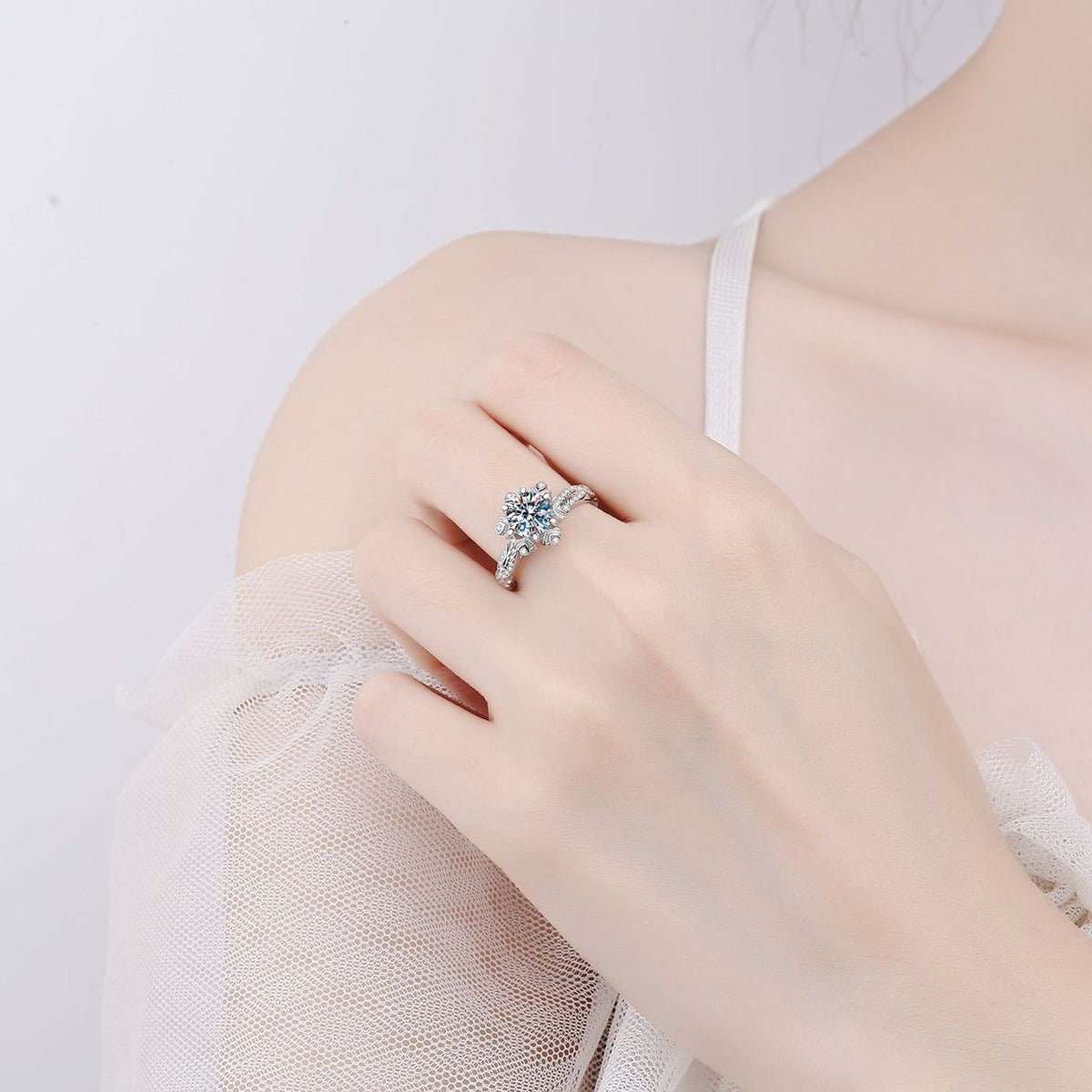 Round Floral Moissanite Engagement Ring with CZ worn on hand to show scale, band width, and ring profile