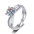 Round Moissanite Side Stone Ring with CZ in Rhodium-Plated S925 Sterling Silver clean white background product photo showing the ring silhouette and moissanite setting