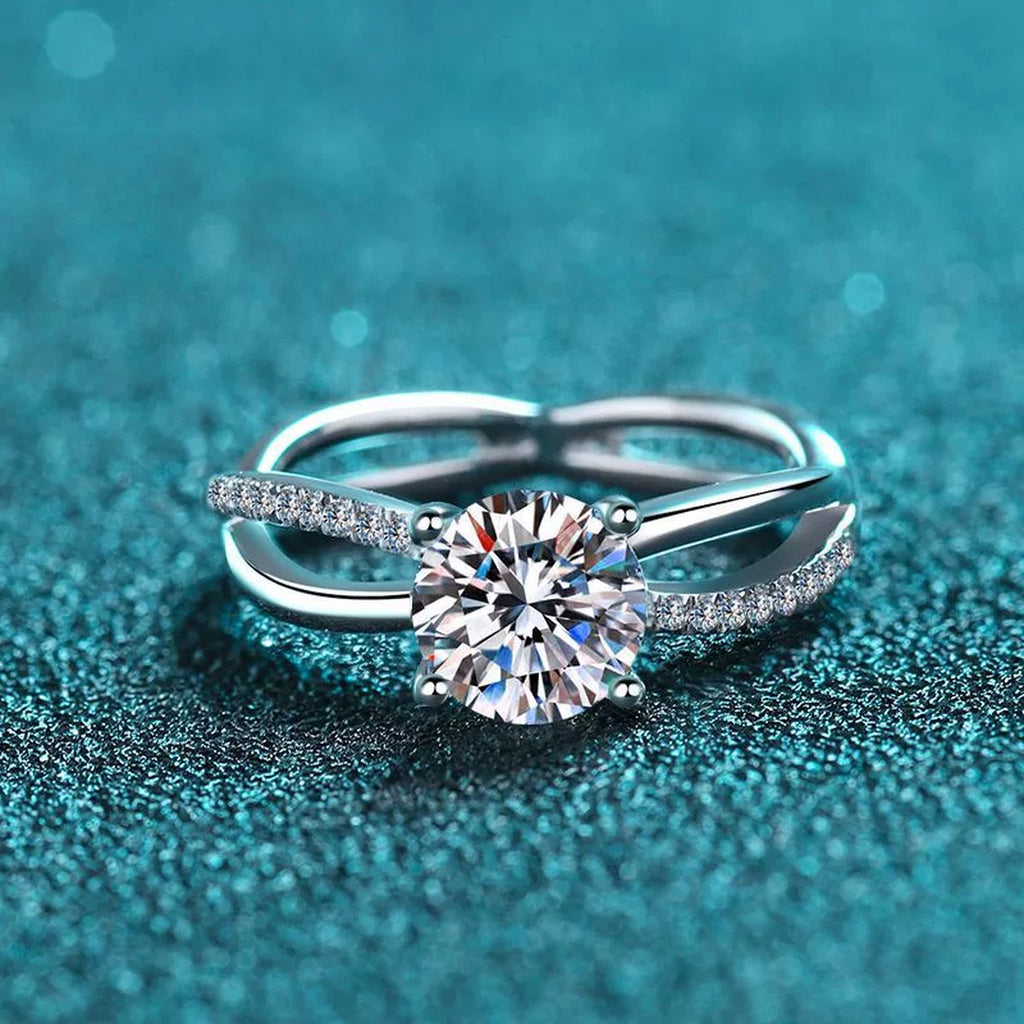 Round Moissanite Side Stone Ring with CZ in Rhodium-Plated S925 Sterling Silver blue display product photo showing the moissanite setting and band profile