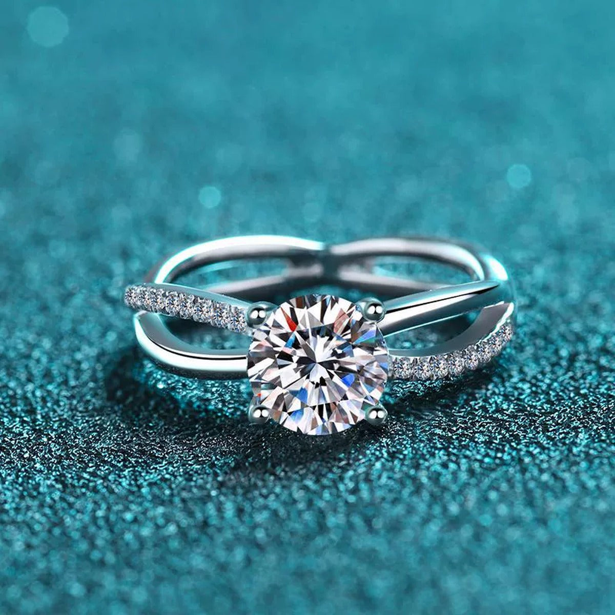Round Moissanite Side Stone Ring with CZ in Rhodium-Plated S925 Sterling Silver blue display product photo showing the moissanite setting and band profile