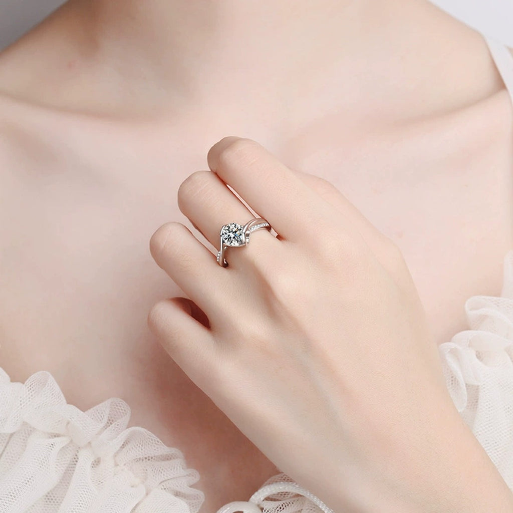 Round Moissanite Side Stone Ring with CZ in Rhodium-Plated S925 Sterling Silver worn on hand, showing scale, finger coverage, and rhodium-plated finish