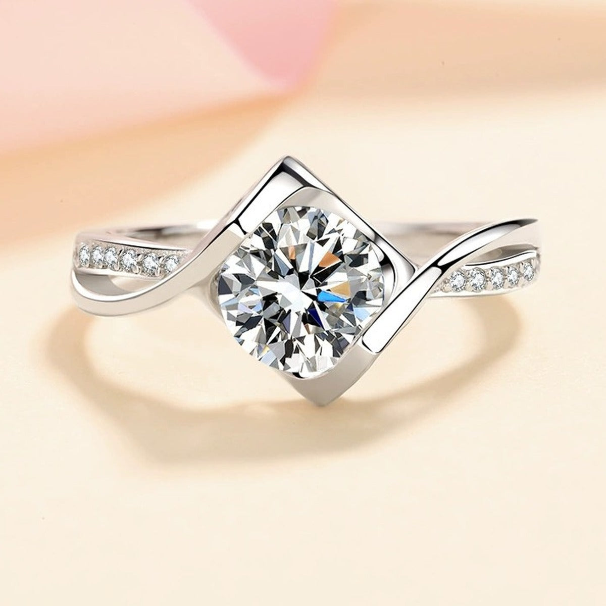 Round Moissanite Side Stone Ring with CZ in Rhodium-Plated S925 Sterling Silver studio product angle showing the ring setting, stone detail, and band design