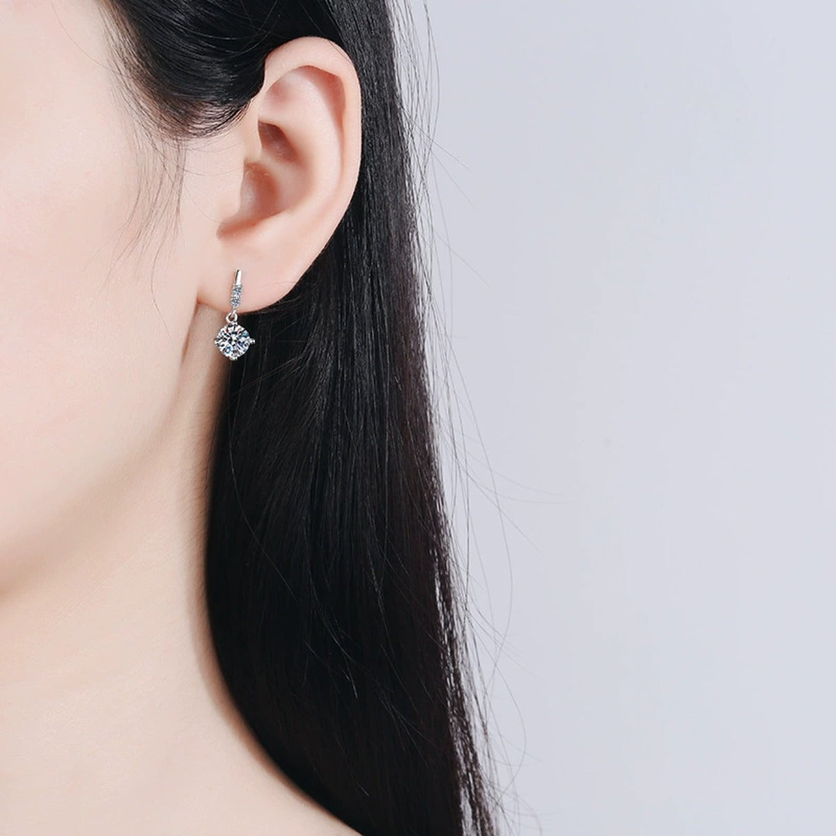 Round Moissanite Stud Dangle Earrings with CZ in Rhodium-Plated S925 sterling silver worn on ear by model showing scale, placement, and stud dangle earrings styling