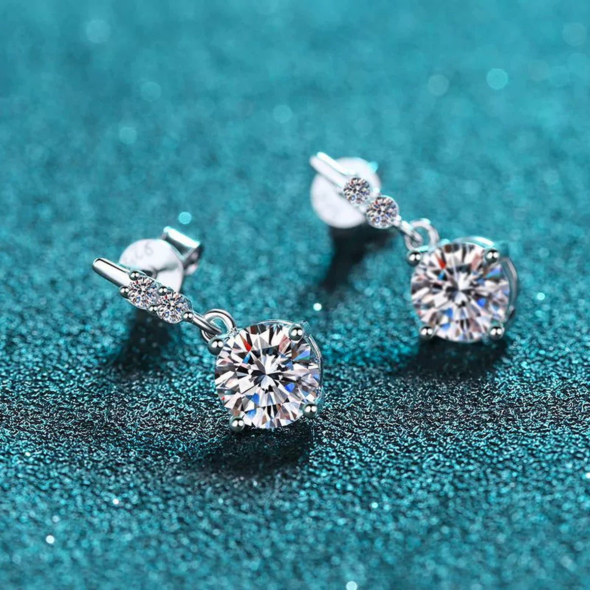Round Moissanite Stud Dangle Earrings with CZ in Rhodium-Plated S925 sterling silver product scene view showing angled setting detail