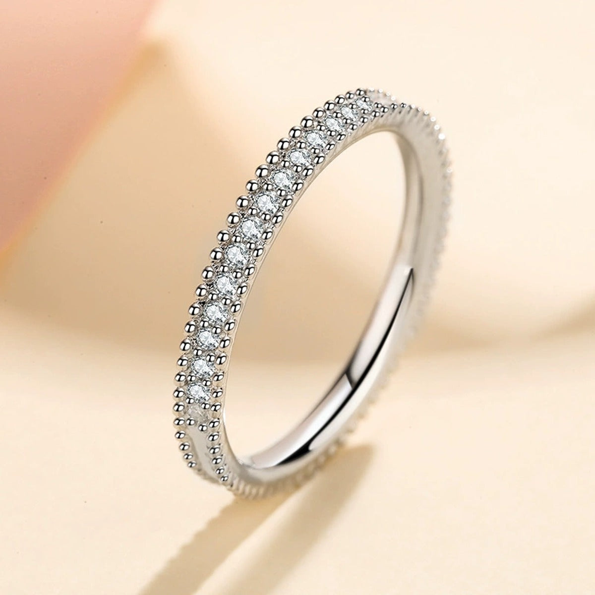 Round Moissanite Ring in Rhodium-Plated S925 Sterling Silver studio product angle showing the ring setting, stone detail, and band design