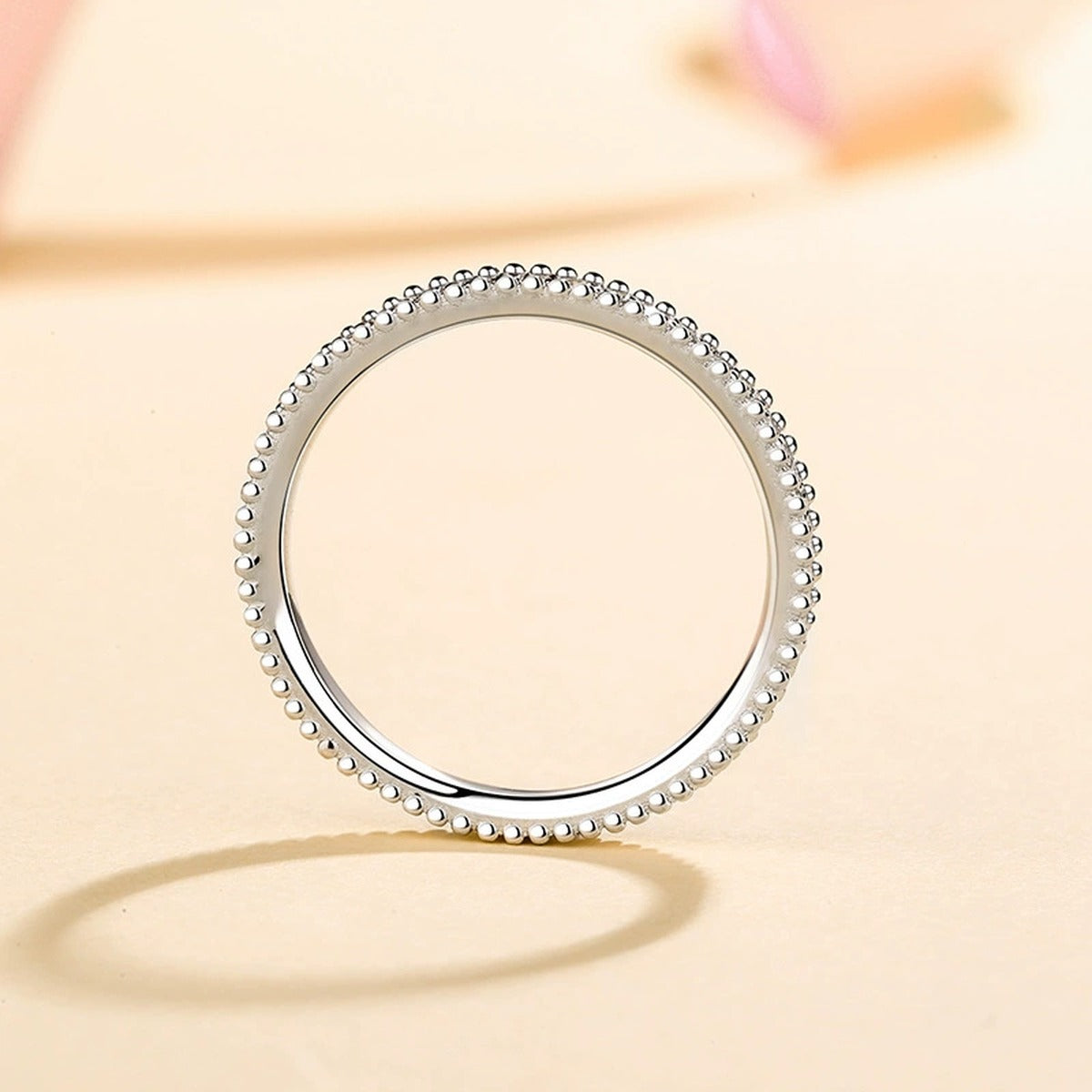 Round Moissanite Ring in Rhodium-Plated S925 Sterling Silver studio product angle showing the ring setting, stone detail, and band design