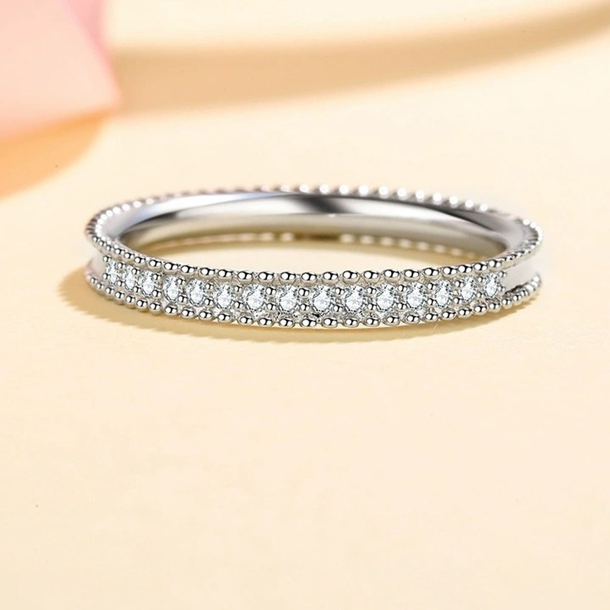 Round Moissanite Ring in Rhodium-Plated S925 Sterling Silver studio product angle showing the ring setting, stone detail, and band design