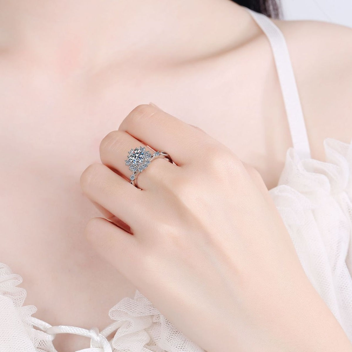 Round Floral Halo Moissanite Ring with CZ worn on hand to show scale, band width, and ring profile