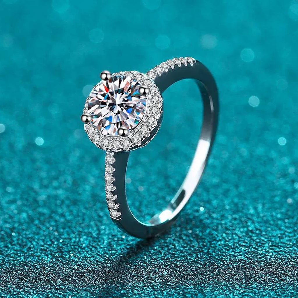Round Moissanite Side Stone Ring with CZ in Rhodium-Plated S925 Sterling Silver blue display product photo showing the moissanite setting and band profile