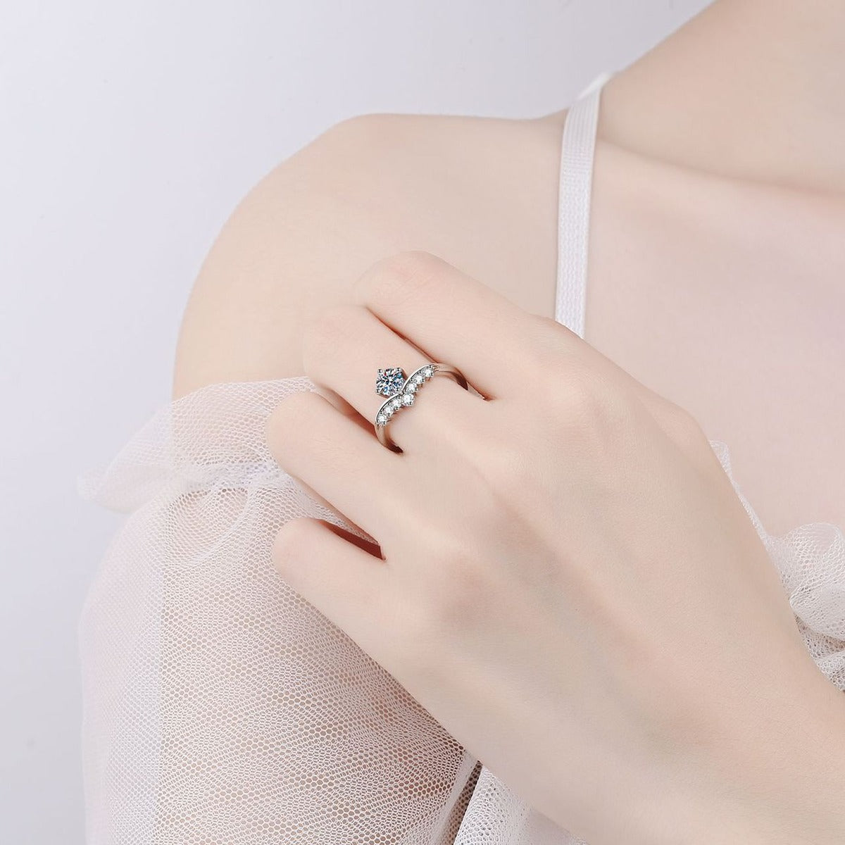 Round Moissanite Chevron Ring with CZ worn on hand to show scale, band width, and ring profile