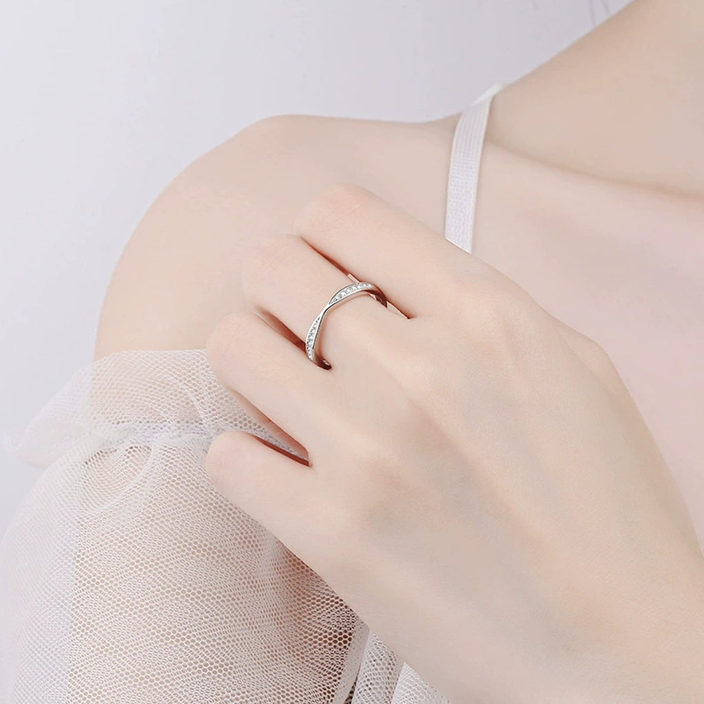 Round Moissanite Ring in Rhodium-Plated S925 Sterling Silver worn on hand, showing scale, finger coverage, and rhodium-plated finish