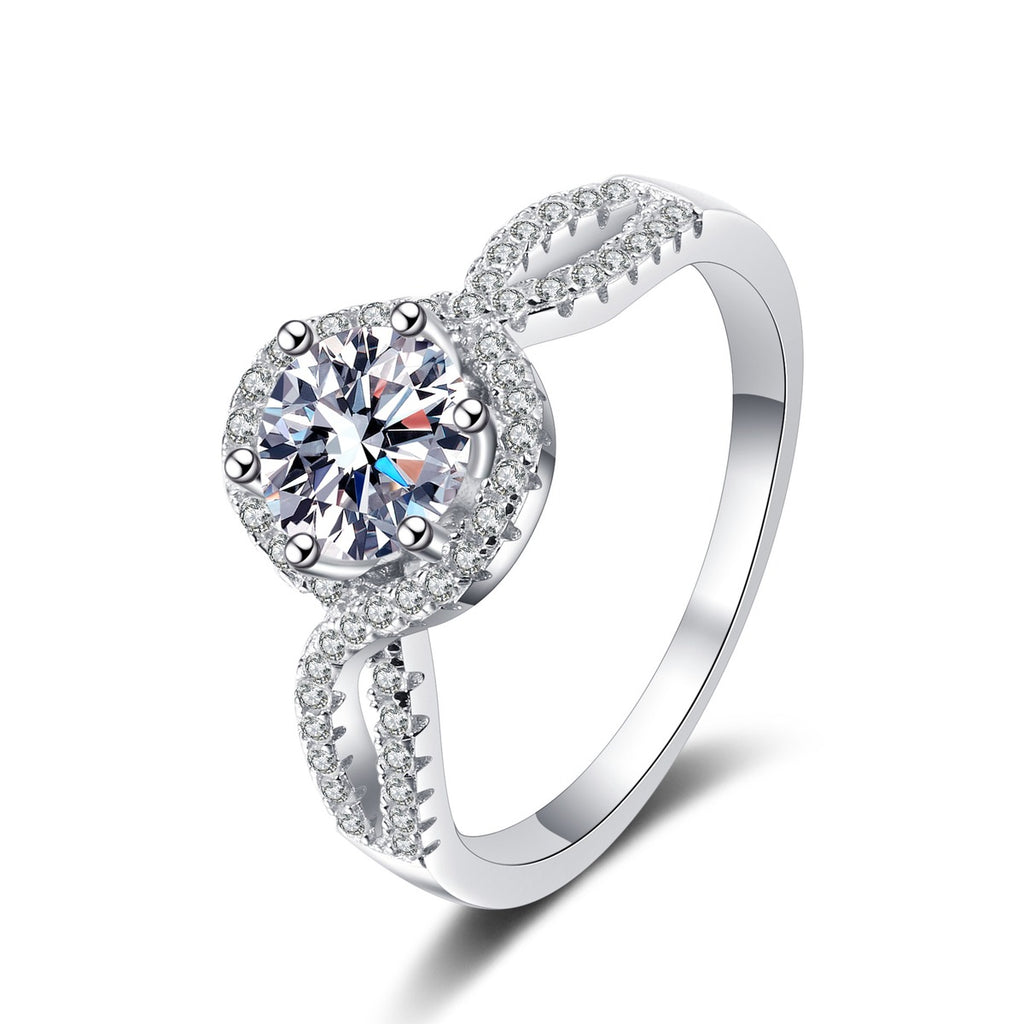 Round Halo Moissanite Twist Ring with CZ in rhodium-plated S925 sterling silver on clean white background