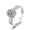 Round Halo Moissanite Twist Ring with CZ in rhodium-plated S925 sterling silver on clean white background