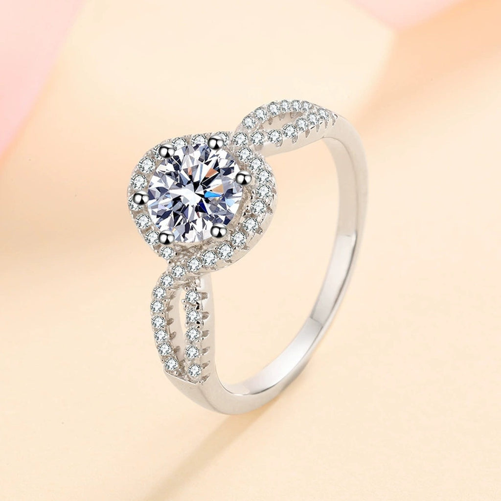 Round Halo Moissanite Twist Ring with CZ product view showing moissanite setting and metal finish