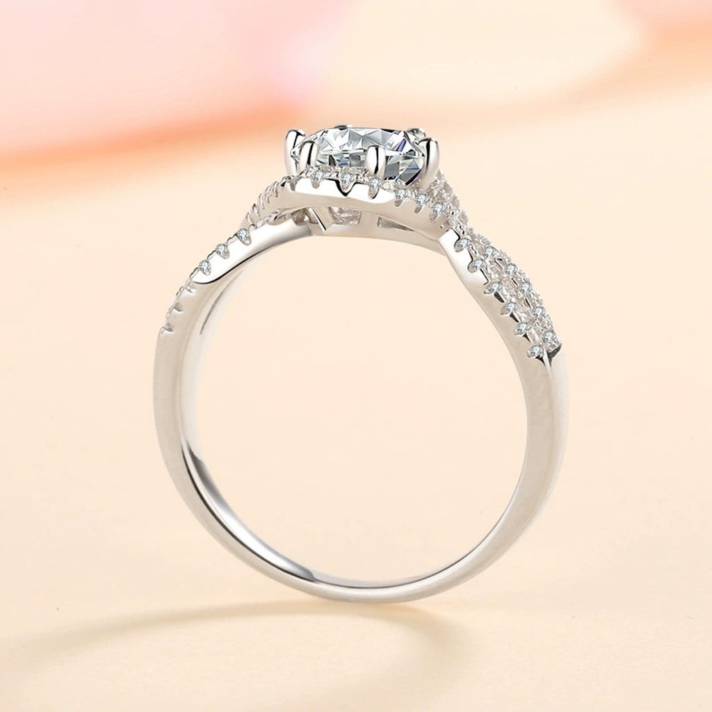 Round Halo Moissanite Twist Ring with CZ product view showing moissanite setting and metal finish