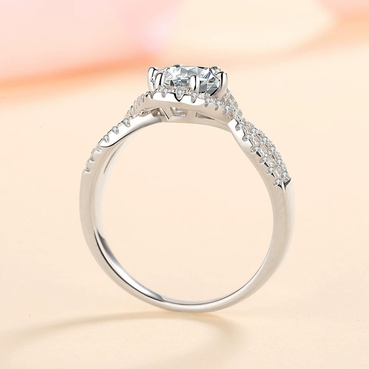 Round Halo Moissanite Twist Ring with CZ product view showing moissanite setting and metal finish