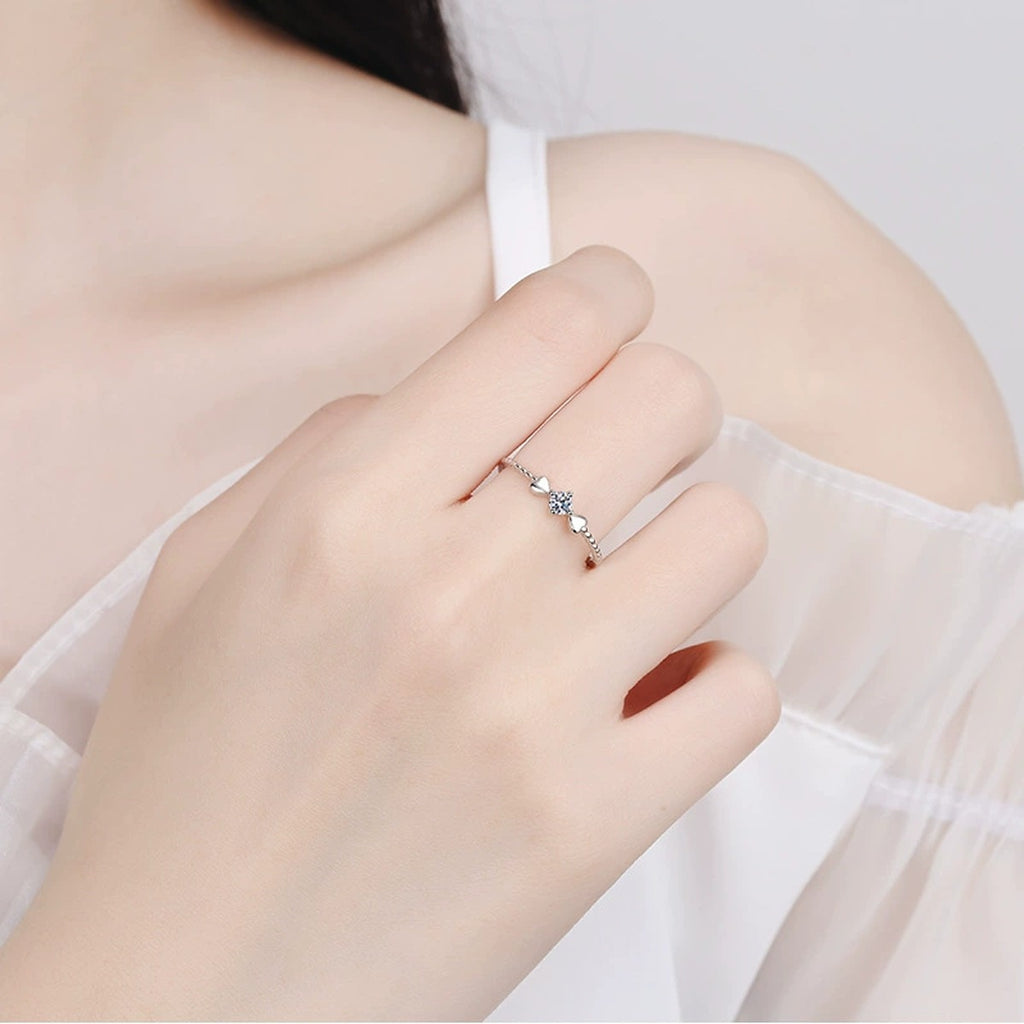 Floral Moissanite Ring in Rhodium-Plated S925 Sterling Silver worn on hand, showing scale, finger coverage, and rhodium-plated finish