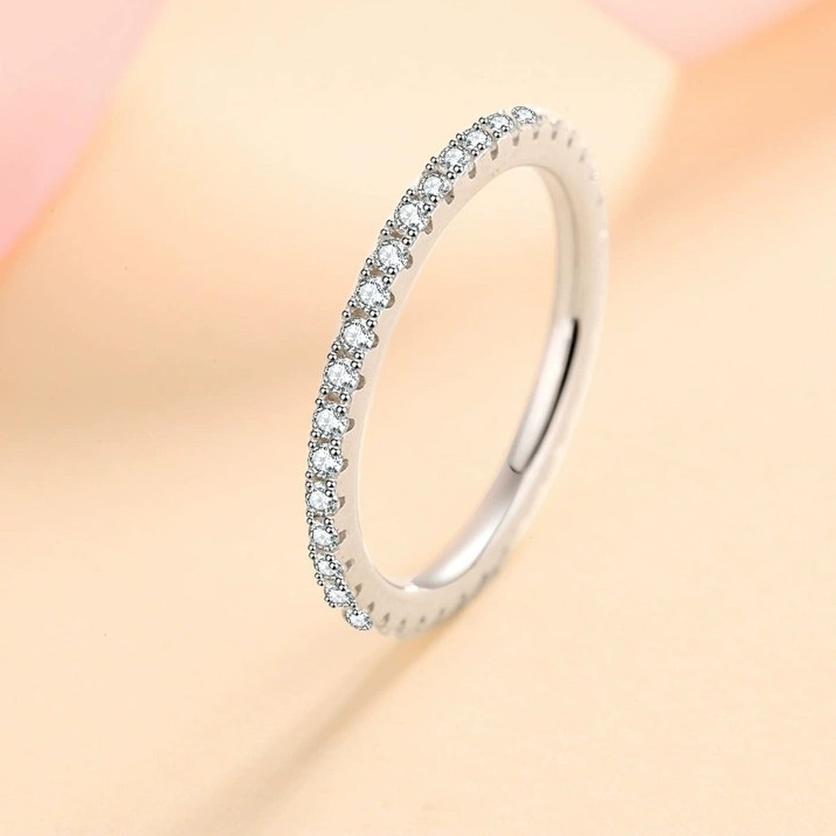 Moissanite Eternity Band Ring in Rhodium-Plated S925 Sterling Silver studio product angle showing the ring setting, stone detail, and band design
