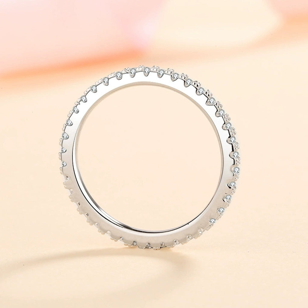 Moissanite Eternity Band Ring in Rhodium-Plated S925 Sterling Silver studio product angle showing the ring setting, stone detail, and band design