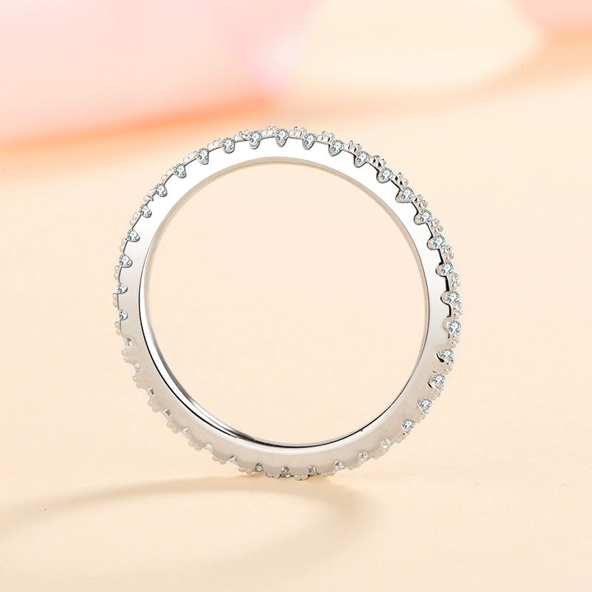 Moissanite Eternity Band Ring in Rhodium-Plated S925 Sterling Silver studio product angle showing the ring setting, stone detail, and band design