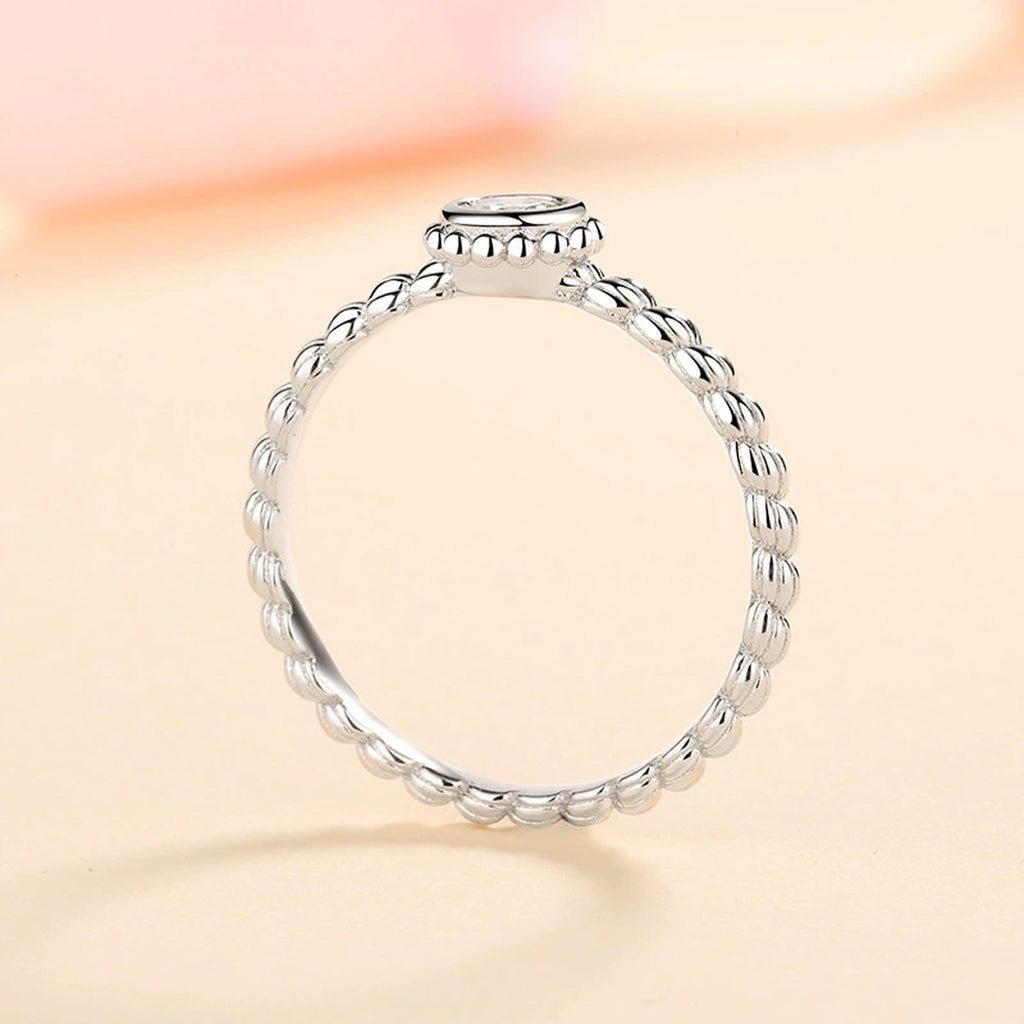 Bezel Moissanite Band Ring in Rhodium-Plated S925 Sterling Silver studio product angle showing the ring setting, stone detail, and band design