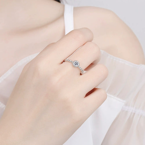 Bezel Moissanite Band Ring in Rhodium-Plated S925 Sterling Silver worn on hand, showing scale, finger coverage, and rhodium-plated finish