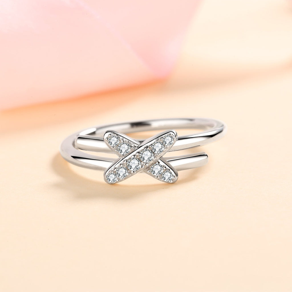Round Moissanite X Ring product view showing moissanite setting and metal finish