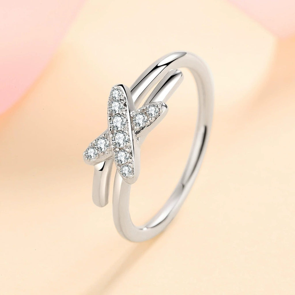Round Moissanite X Ring product view showing moissanite setting and metal finish