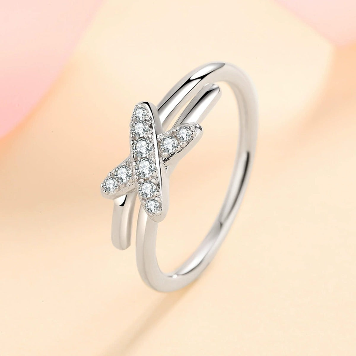 Round Moissanite X Ring product view showing moissanite setting and metal finish