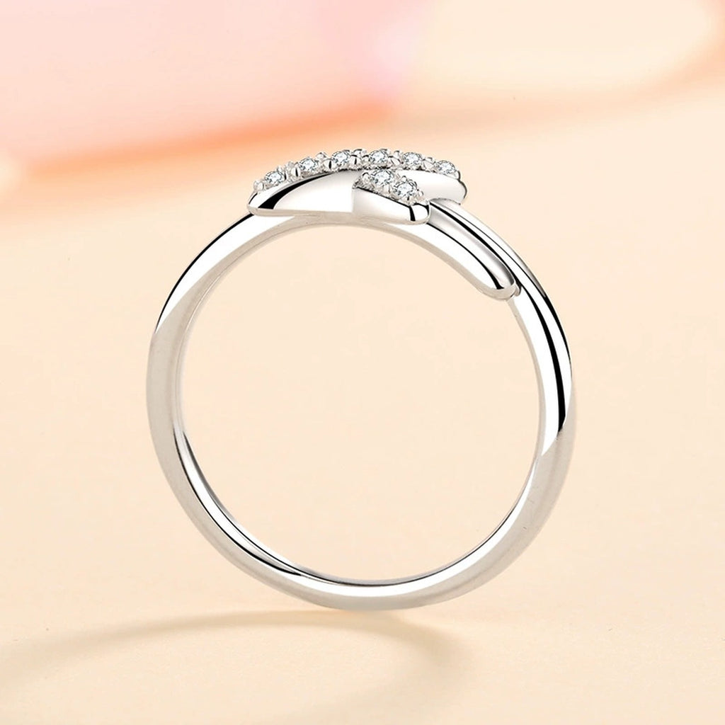 Round Moissanite X Ring product view showing moissanite setting and metal finish