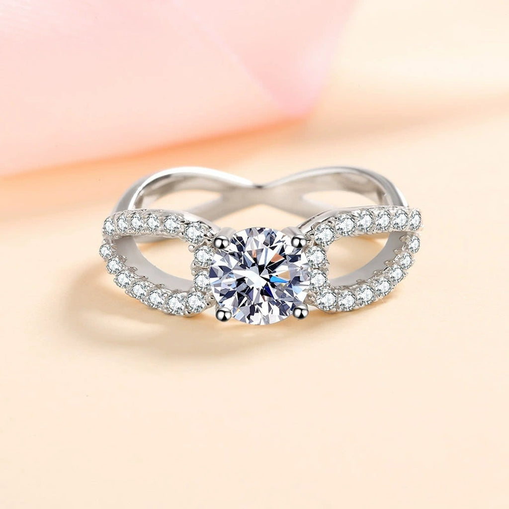 Round Moissanite Side Stone Engagement Ring with CZ worn on hand to show scale, band width, and ring profile