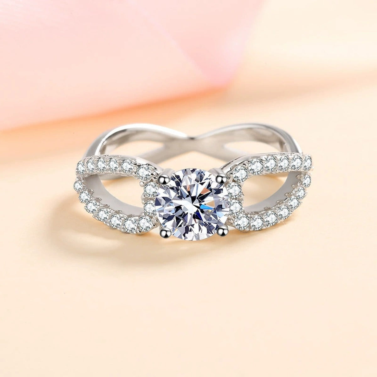 Round Moissanite Side Stone Engagement Ring with CZ worn on hand to show scale, band width, and ring profile