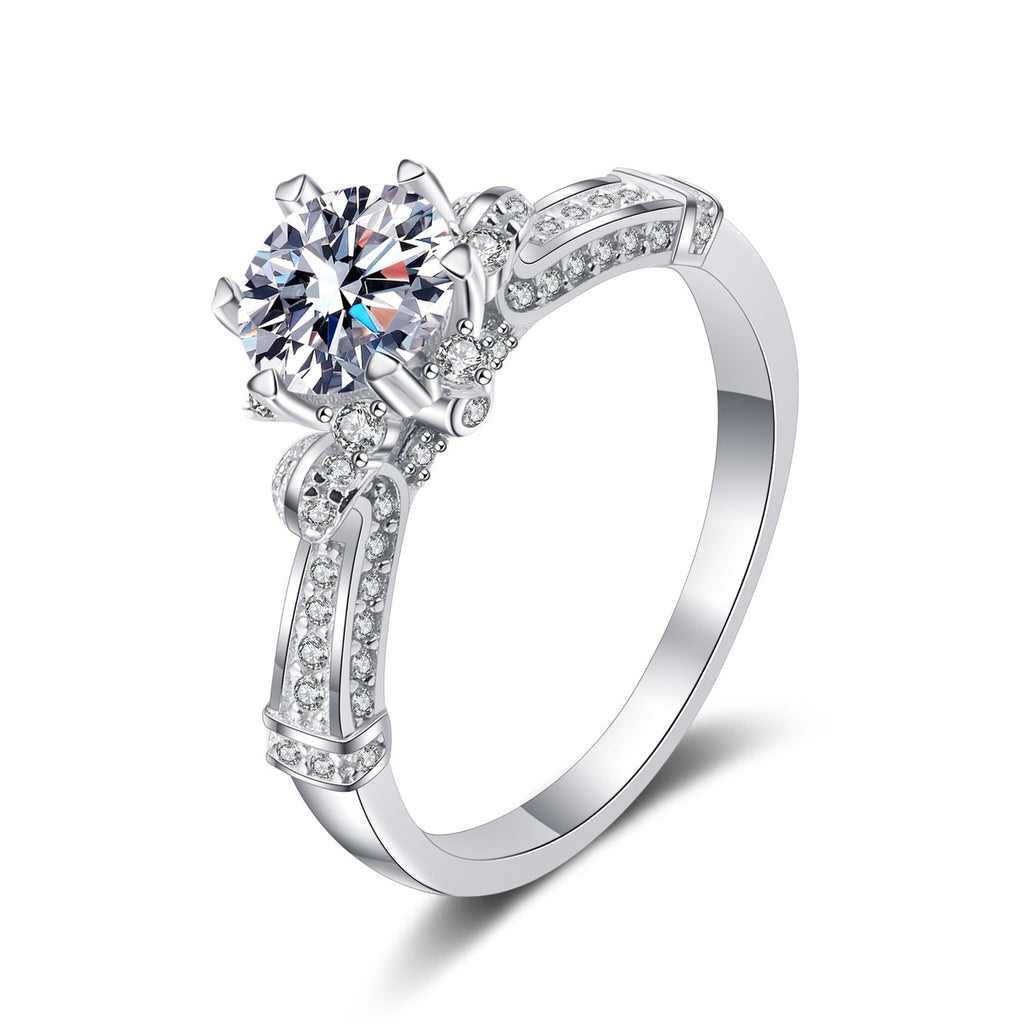 Round Moissanite Side Stone Ring with CZ in rhodium-plated S925 sterling silver on clean white background