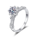 Round Moissanite Side Stone Ring with CZ in rhodium-plated S925 sterling silver on clean white background