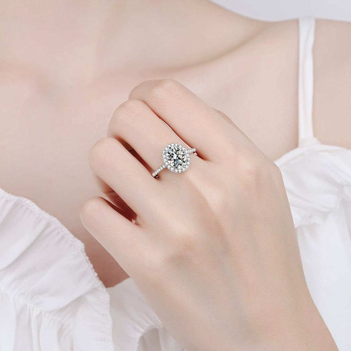 Oval Moissanite Ring with CZ in Rhodium-Plated S925 Sterling Silver worn on hand, showing scale, finger coverage, and rhodium-plated finish