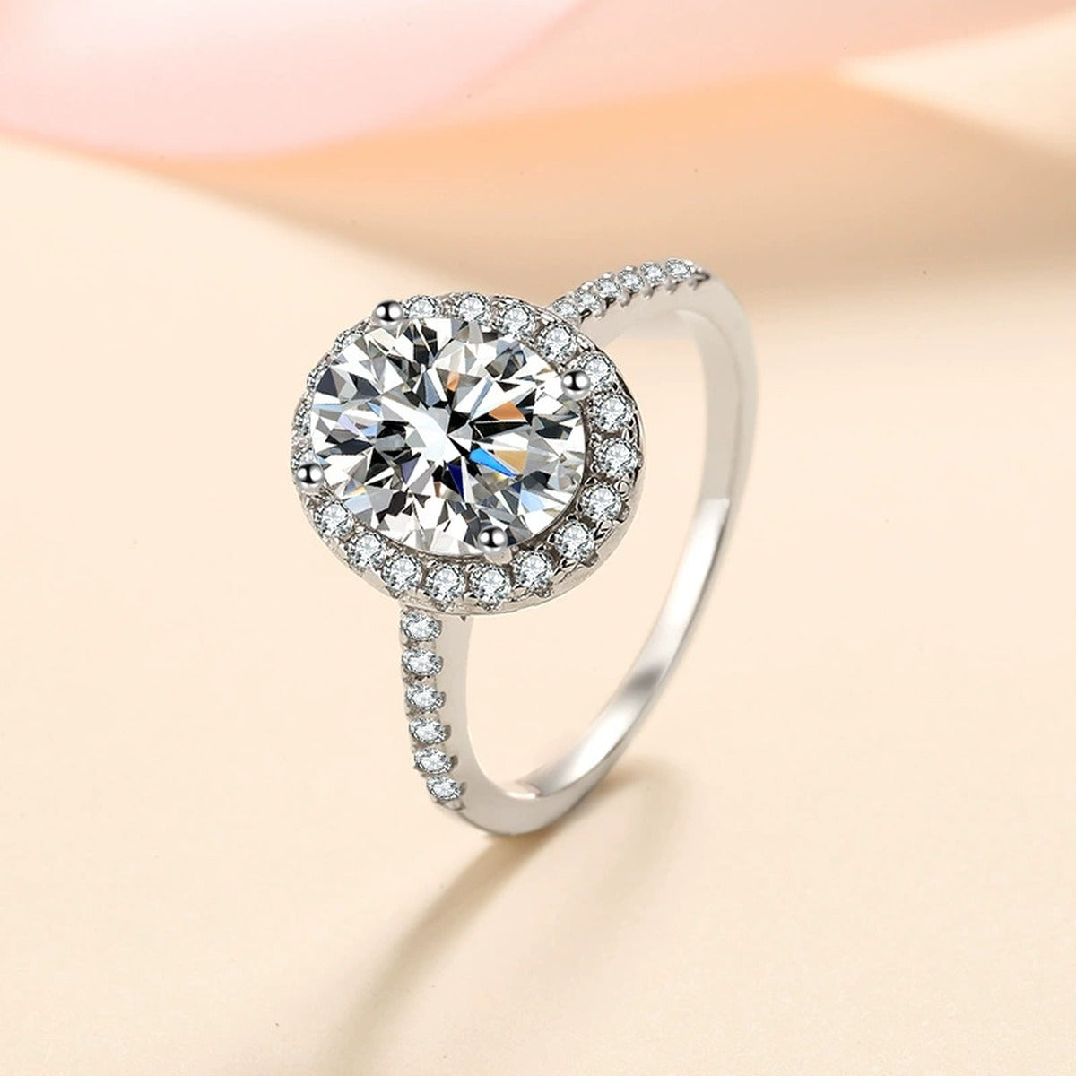 Oval Moissanite Ring with CZ in Rhodium-Plated S925 Sterling Silver studio product angle showing the ring setting, stone detail, and band design