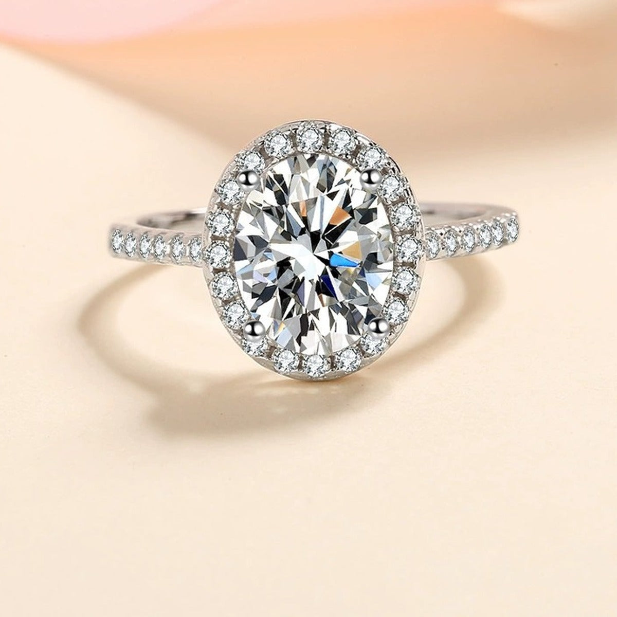 Oval Moissanite Ring with CZ in Rhodium-Plated S925 Sterling Silver studio product angle showing the ring setting, stone detail, and band design
