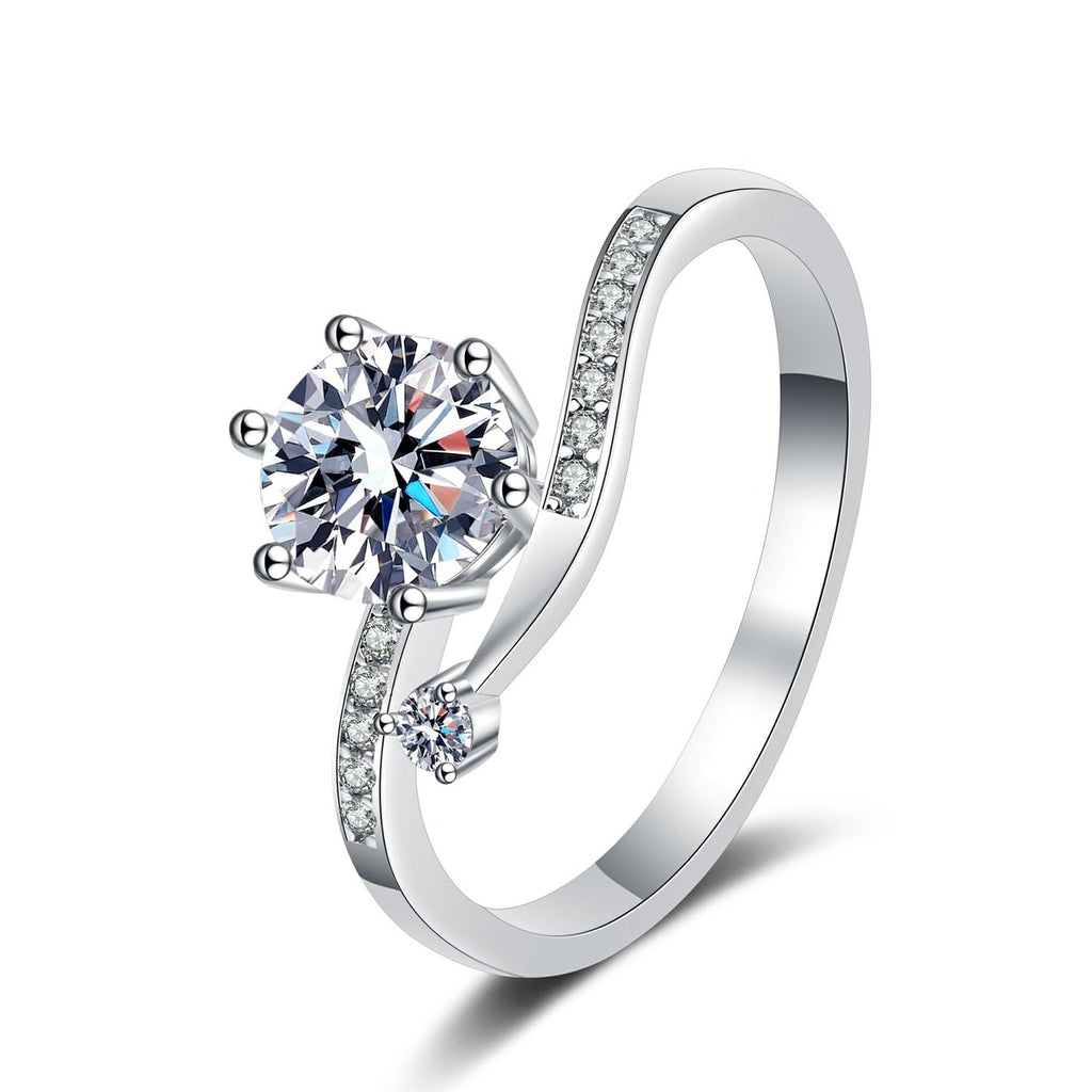Round Moissanite Side Stone Ring with CZ in Rhodium-Plated S925 Sterling Silver clean white background product photo showing the ring silhouette and moissanite setting