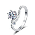 Round Moissanite Side Stone Ring with CZ in Rhodium-Plated S925 Sterling Silver clean white background product photo showing the ring silhouette and moissanite setting