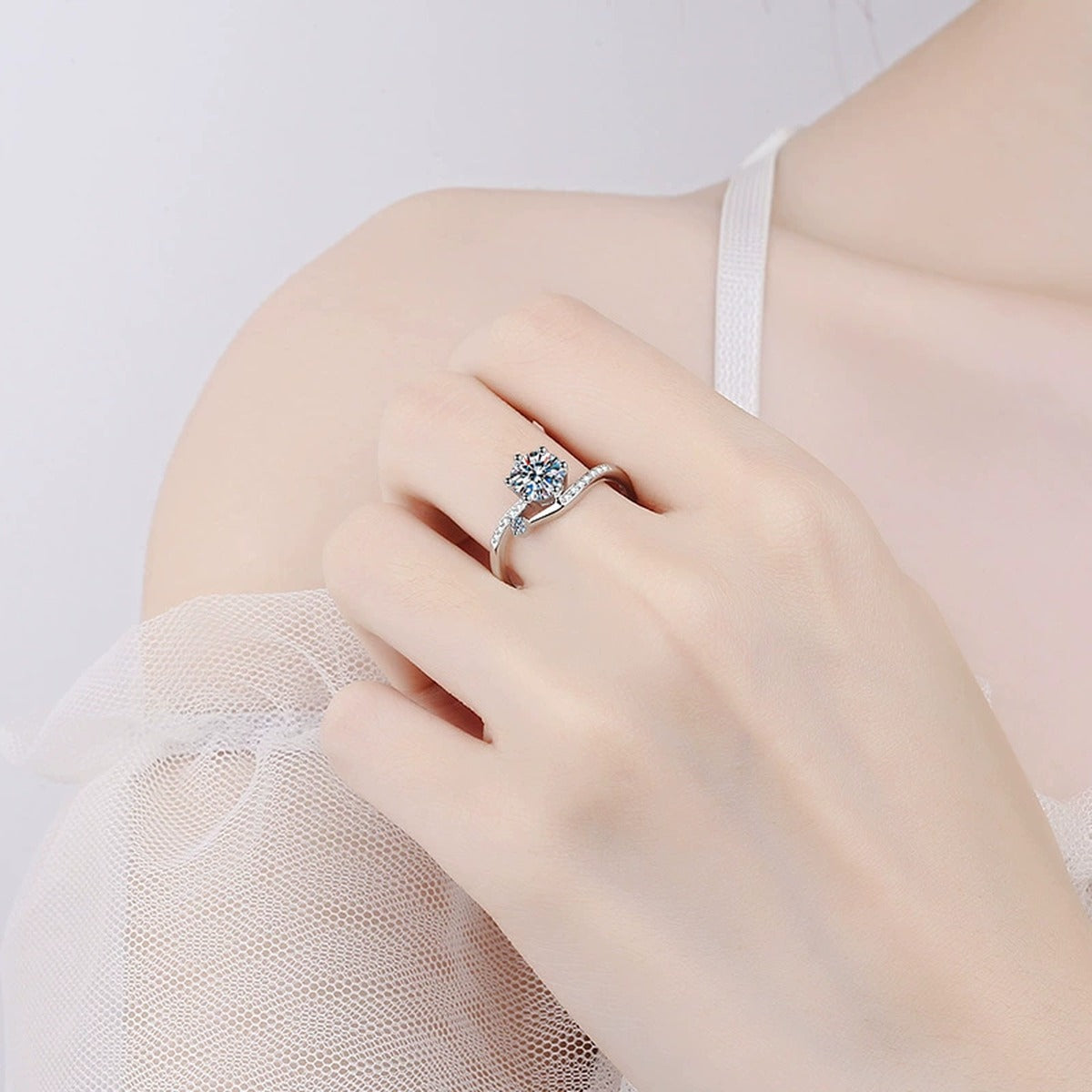 Round Moissanite Side Stone Ring with CZ in Rhodium-Plated S925 Sterling Silver worn on hand, showing scale, finger coverage, and rhodium-plated finish