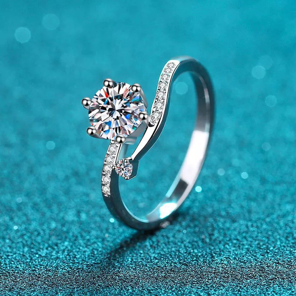 Round Moissanite Side Stone Ring with CZ in Rhodium-Plated S925 Sterling Silver blue display product photo showing the moissanite setting and band profile